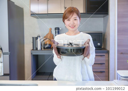 A woman making cooking A woman making cooking 101199012