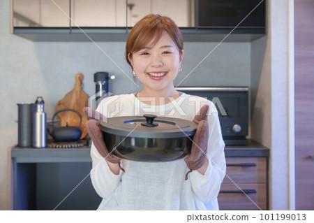 A woman making cooking A woman making cooking 101199013