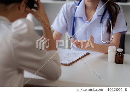 Doctor holding hand patient woman at clinic. health care, medical, healthy concept Doctor holding hand patient woman at clinic. health care, medical, healthy concept 101200648