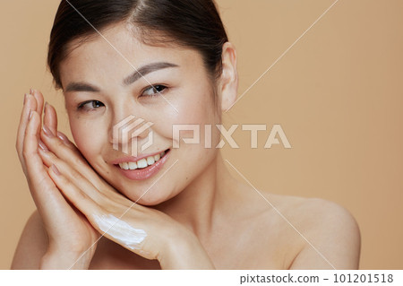 Portrait of modern asian woman with hand cream Portrait of modern asian woman with hand cream 101201518