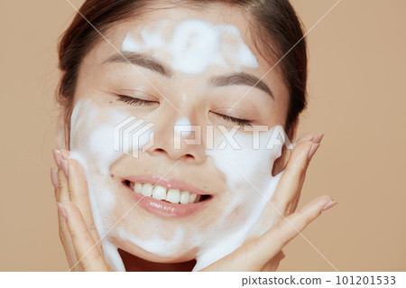 Portrait of modern asian woman washing face 101201533