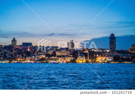 Istanbul at sunset, Turkey. Tourist boat sails on Golden Horn in summer. Beautiful sunny view of Istanbul waterfront with old mosque. Concept of travel, tourism and vacation in Istanbul and Turkey Istanbul at sunset, Turkey. Tourist boat sails on Golden Horn in summer. Beautiful sunny view of Istanbul waterfront with old mosque. Concept of travel, tourism and vacation in Istanbul and Turkey 101201739