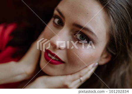 Portrait of young woman with evening make-up. Portrait of young woman with evening make-up. 101202834