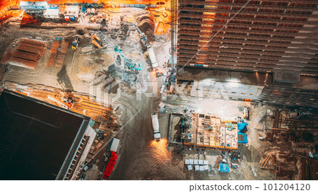 Nightwork Development Of Modern Multi-storey Residential Houses. Workers Welding Building Skeleton. Processing Of Metal Structures Building Skeleton. Development Multistorey Residential Building 101204120