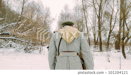 Men Dressed As White Guard Soldiers Of Imperial Russian Army In Russian Civil War s Marching Through Snowy Winter Forest. Historical Reenactment 101204121