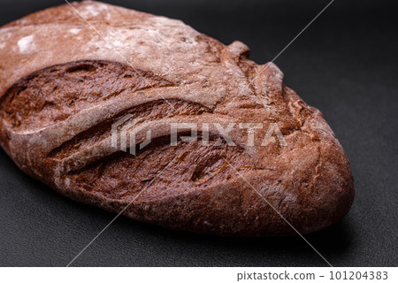 Delicious fresh crispy brown bread with cereal grains and spices 101204383