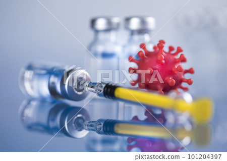 Close up medical syringe with a vaccine 101204397