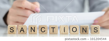 Text sanctions list on white note paper Text sanctions list on white note paper 101204544