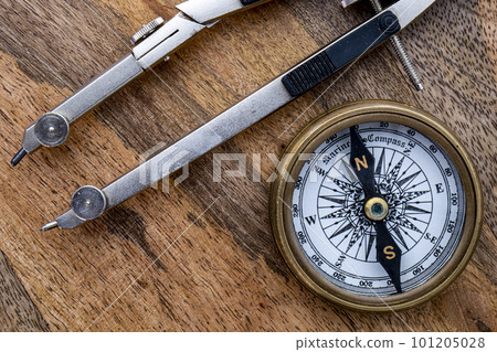 Directional compass drawing compass on wooden surface. High quality photo 101205028