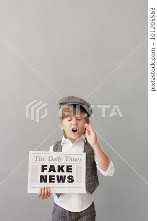 Newsboy shouting against grunge wall background. Boy selling fake news 101205563