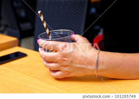 Young woman having a cup of coffee Young woman having a cup of coffee 101205749