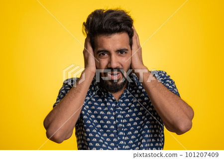 Annoyed irritated handsome man covering ears gesturing No avoiding advice ignoring noise loud voices Annoyed irritated handsome man covering ears gesturing No avoiding advice ignoring noise loud voices 101207409