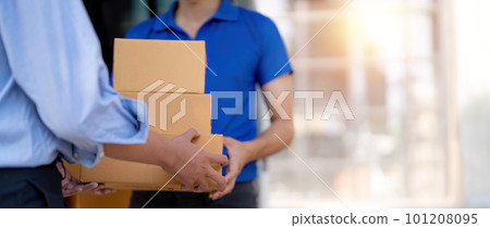 Home delivery service and working service mind. Man customer hand receiving a cardboard boxes parcel from delivery service courier. delivery logistic concept 101208095