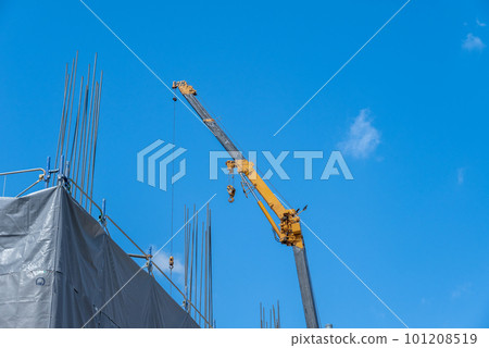 Blue sky, crane and rebar construction Blue sky, crane and rebar construction 101208519