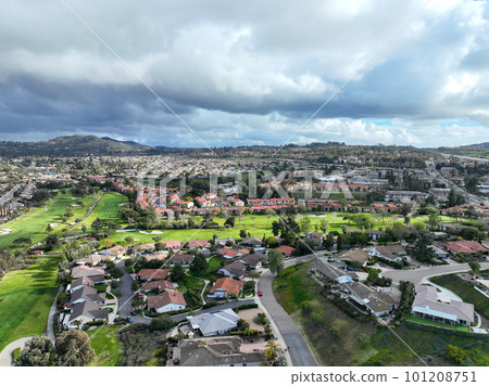 Aerial view of residential neighborhood surrounded by golf and valley during cloudy day in Rancho Bernardo 101208751