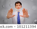 Asian man wear masks  raise your hand to protect PM 2.5 dust and air pollution and headache and sickness, air pollution concept, healthcare concept. 101211394