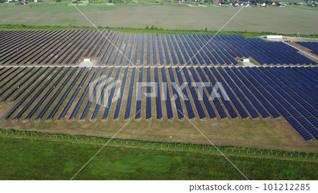 Solar power plant. Many blue panels of a large solar power plant. Aerial drone view. Solar power station. Green clean electricity. New modern technologies. Ecological alternative innovation technology 101212285