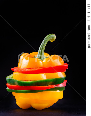 Three sweet peppers on a wooden background, Cooking vegetable salad Three sweet peppers on a wooden background, Cooking vegetable salad 101212411
