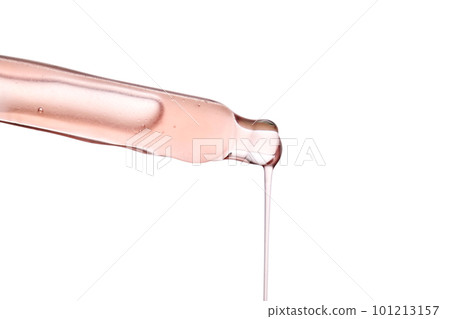 Pipette with a viscous pink cosmetic close-up. 101213157
