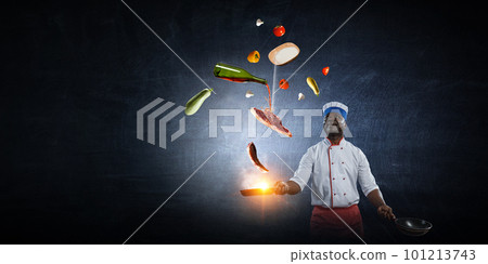 Chef cooking on black background 101213743