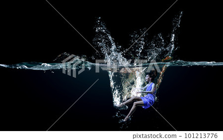 Professional woman swimmer on a wave Professional woman swimmer on a wave 101213776