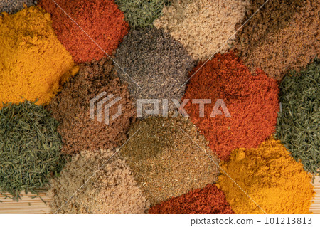 Heap different Asian Spices lies on wooden background. Spice and seasoning. Various fragrant spice market. Assortment spices and herbs for cooking Heap different Asian Spices lies on wooden background. Spice and seasoning. Various fragrant spice market. Assortment spices and herbs for cooking 101213813