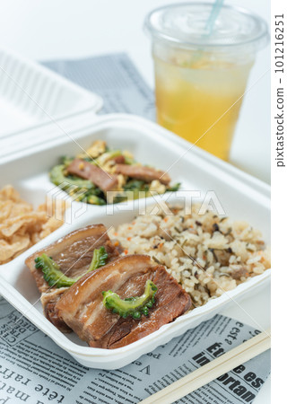 A bento box in a take-out container of Okinawan cuisine, vertical position 101216251