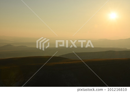 Idyllic landscape of hills in fog at sunrise in Cappadocia, Turkey 101216810