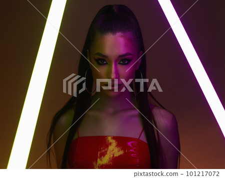beautiful young woman with neon lamp. Dancer girl in latex beautiful young woman with neon lamp. Dancer girl in latex 101217072