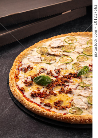 Big assorted pizza with variety of toppings Big assorted pizza with variety of toppings 101217562