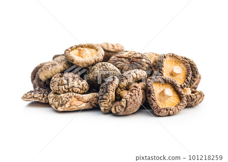 Dried shiitake mushrooms isolated on white background. Dried shiitake mushrooms isolated on white background. 101218259