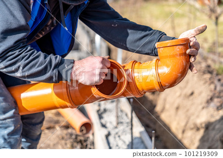 orange PVC plastic pipes on the construction site 101219309