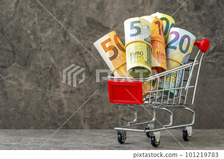 Economic concept. Shopping cart with euro banknotes. Economic concept. Shopping cart with euro banknotes. 101219783