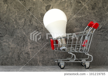 Shopping cart with bright glowing light bulb Shopping cart with bright glowing light bulb 101219785