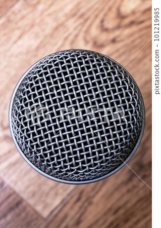 Microphone on wooden background top view closeup 101219985