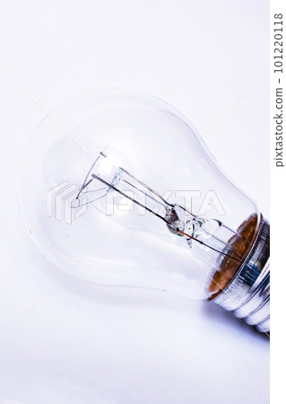 Old light bulb on a gray background Old light bulb on a gray background 101220118