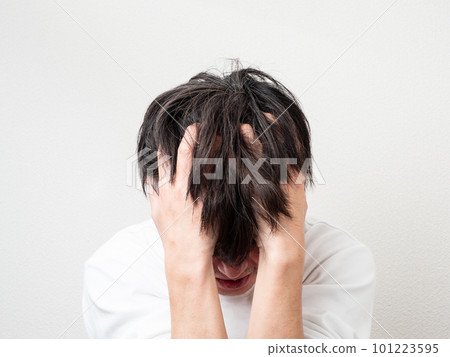Man holding his head Man holding his head 101223595