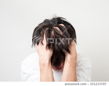 Man holding his head Man holding his head 101223597