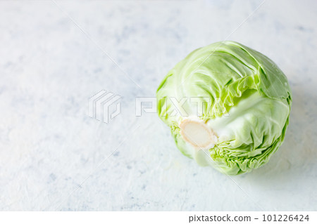 Fresh raw whole cabbage on white table. Organic healthy food. Top view with copy space 101226424