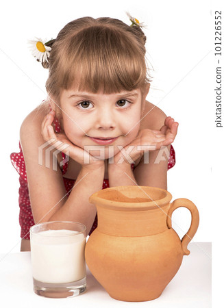 Little girl and milk. Little cute girl holding clay jug with milk isolated on the white background Little girl and milk. Little cute girl holding clay jug with milk isolated on the white background 101226552
