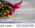 Mockup wooden background with purple calla lilly 101226596