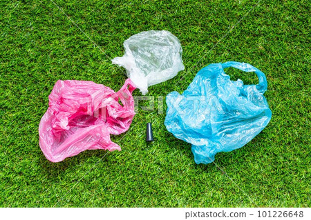 Mouthpiece for shisha om the green grass backround. Plastic waste concept. Plastic trash garbage, save nature. Parts of hookah, tobacco Hookah Shisha Mouthpiece on grass background. 101226648