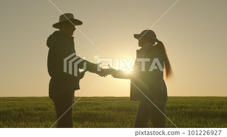 handshake silhouette. farmers businessmen shake hands with each other sunset. have deal. negotiate deal. partnerships. teamwork. Wheat field. Agriculture. farming concept. group people shaking hands handshake silhouette. farmers businessmen shake hands with each other sunset. have deal. negotiate deal. partnerships. teamwork. Wheat field. Agriculture. farming concept. group people shaking hands 101226927