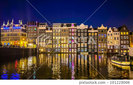 Damrak narrow houses at night in Amsterdam center, Netherlands Damrak narrow houses at night in Amsterdam center, Netherlands 101228006