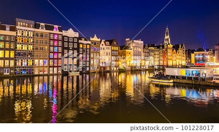Damrak narrow houses at night in Amsterdam center, Netherlands Damrak narrow houses at night in Amsterdam center, Netherlands 101228017