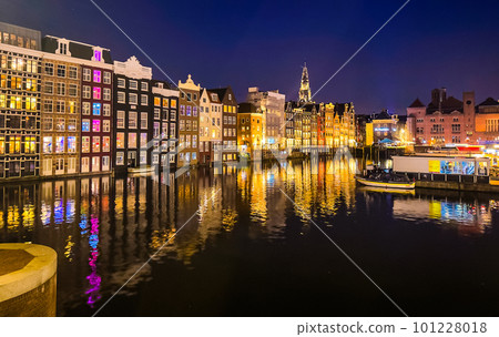 Damrak narrow houses at night in Amsterdam center, Netherlands Damrak narrow houses at night in Amsterdam center, Netherlands 101228018
