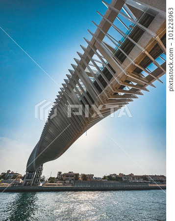 Dubai Water Canal Helix Bridge, pedestrian bridge with water taxi, in Dubai, UAE 101228963