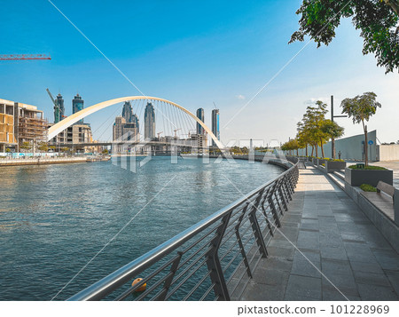 Dubai Water Canal Tolerance Bridge, pedestrian bridge with water taxi, in Dubai, UAE 101228969