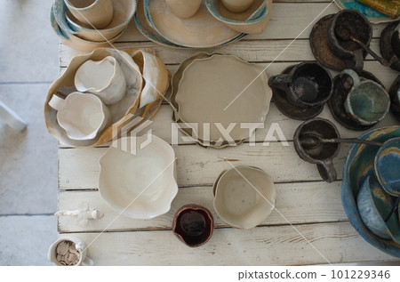 a lot of handmade ceramic products top view. a lot of handmade ceramic products top view. 101229346