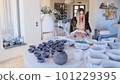 a female ceramist sculpts pottery. 101229395